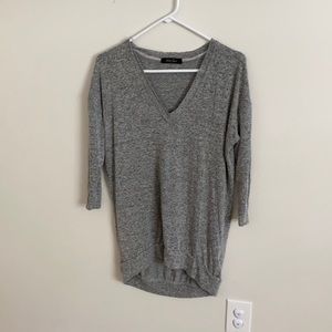 Grey v-neck tunic with raw edge neckline